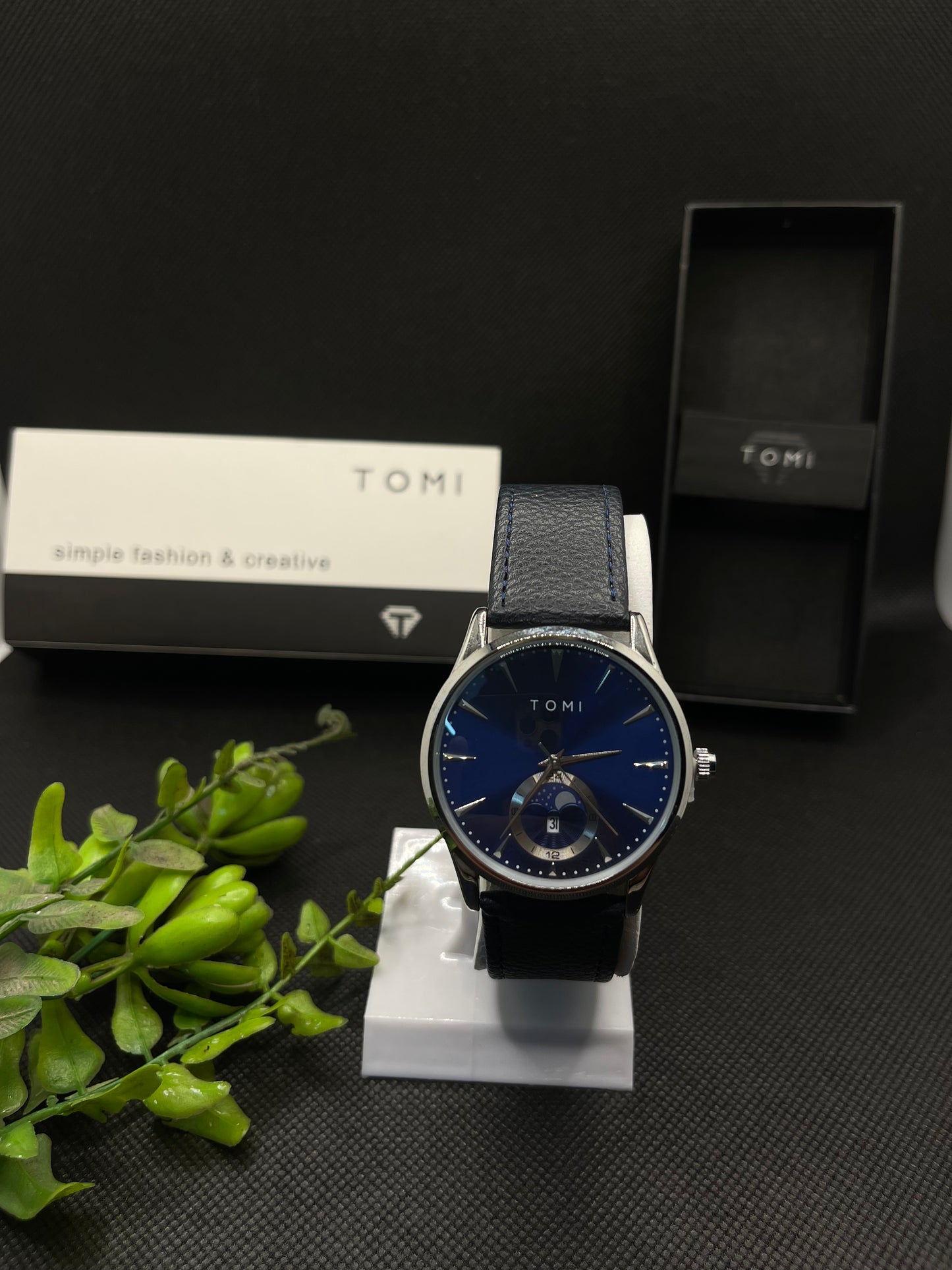 TOMI METALLIC BLUE DIAL WITH BLUE LEATHER STRAP IN MAGNETIC LOCK